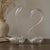 Elevate your space with this exquisite pair of vintage glass swan bud vases, crafted in delicate clear blown glass with...