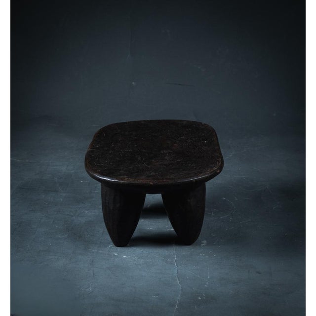 This Senoufo wooden stool is both functional and decorative. Made of quality wood by hand in a single piece of wood. A...