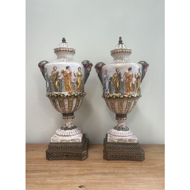 Pair of Vintage Capodimonte Style Porcelain Urns. Can be easily transformed into lamps if desired.