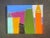 Bold and bright shapes and colors suggest an abstracted city scape. 24 x 30 x 1.5. Edges painted pale grey, back wired,...