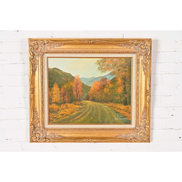 A beautiful original oil painting of a scenic fall drive in carved giltwood frame Signed by artist: Art Reiner USA, Circa...