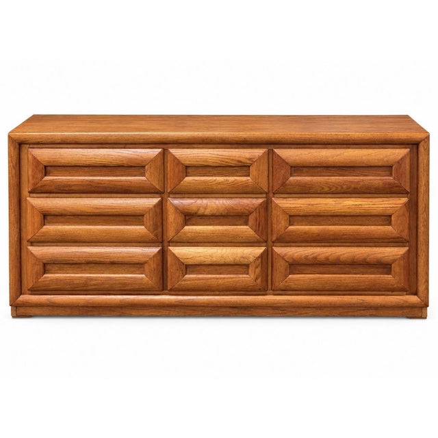 Vintage Bassett nine-drawer dresser featuring bold, sculptural geometric drawer fronts, integrated pulls, and richly...