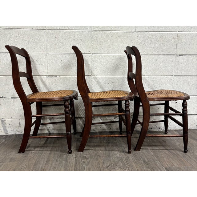 Early 20th Century Vintage Victorian Eastlake Style Ladder Back Cane Seat Dining Chairs - Set of 3 For Sale - Image 5 of 9