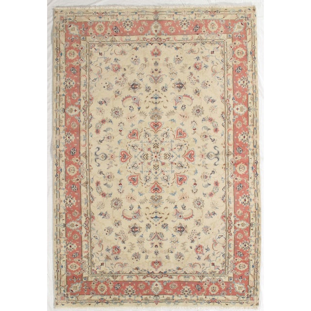 Vintage Hand-knotted Persian Tabriz rug from northwest Iran, known for its fine weave and detailed floral patterns....