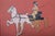 A striking circa 1900 equestrian print titled Carriage Drive, presented in a substantial period wood frame and retaining...