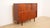 A beautiful vintage highboard in warm teak, featuring characteristic 1960s Danish design. This Danish cabinet boasts clean...
