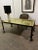 Hand-crafted French Deco wrought iron table with very interesting rolled and hammered disks to the lower portion of each...