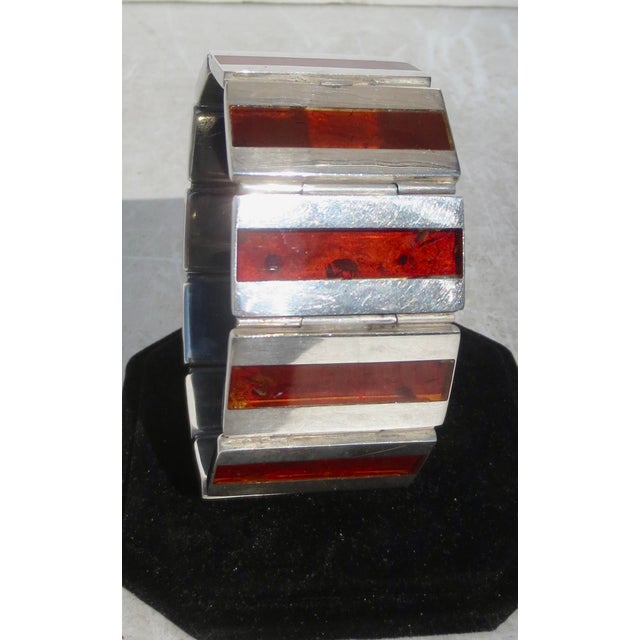 Russian Marks on Silver sectional cuff. Glass faux Tortoise bands and hallmarked to the tab with Russian makers. The...
