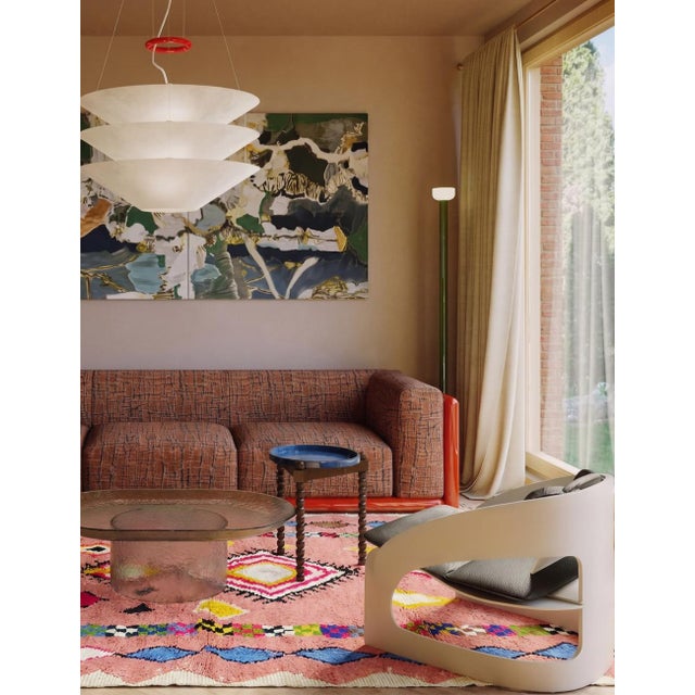 Boujad Rug | Handwoven Berber Wool Rug with Pink Field and Diamond Medallion This vibrant Boujad rug features a soft...