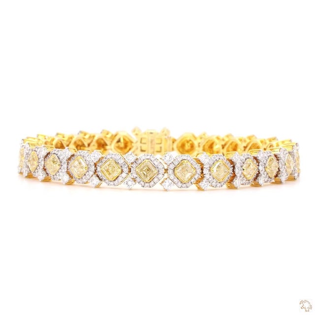 This statement bracelet from our contemporary estate collection centers on vivid yellow diamond accents totaling 6.8...