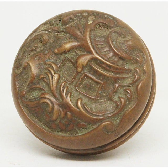 Rococo style bronze entry door knob was made by Reading in the 1899 catalog. It belongs to the B-21100 Belfort group. The...