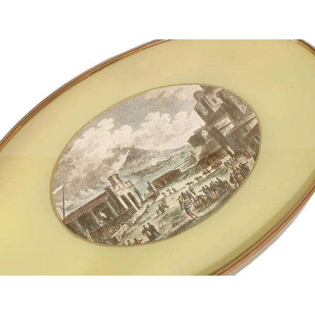 Mid-century modern coffee table by cesare lacca in gilt brass, top in shaped crystal with polished edge, printing of...