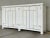Stylish Organic Modern Aged White Finished Wood Sideboard, four doors, four shelves, showroom floor sample