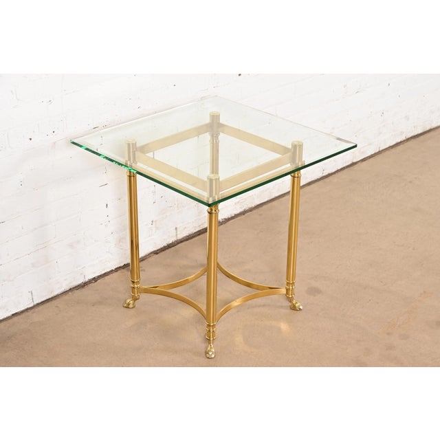 A gorgeous Mid-Century Modern Hollywood Regency side table with hooved feet By Labarge USA, Circa 1960s Solid brass frame,...