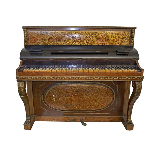 Beautiful vertical piano in ancient "boulle" style with defects and damage to decorations, due to age and use.