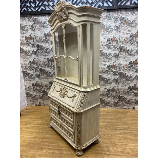 Vintage French Provincial Hand Carved White Secretary Desk and Display Cabinet This hand carved secretary desk has three...