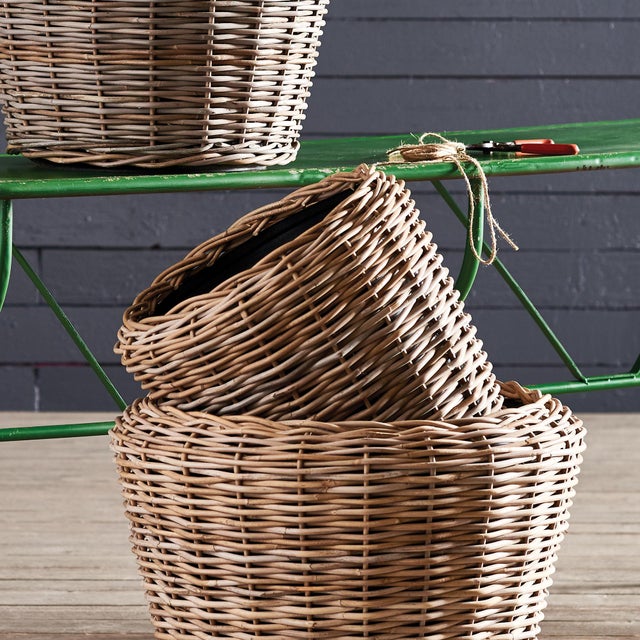Here, s a smart idea a thick rattan planter tightly woven around grower, s pots. The plastic pot helps the weave retain...