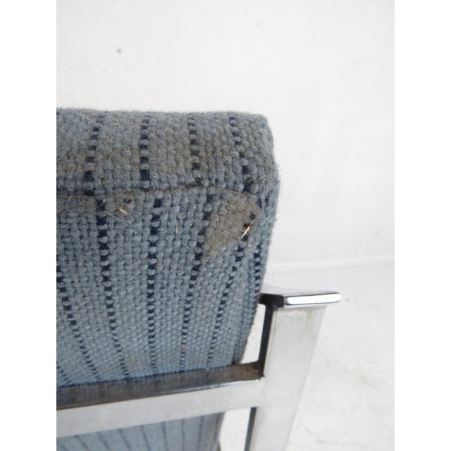 This stunning vintage modern pair of lounge chairs feature a heavy flat bar chrome frame and thick padded seats. The...