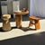 Side table in solid suar wood with a circular top and column base. Elegant and timeless geometric shape. The piece is...