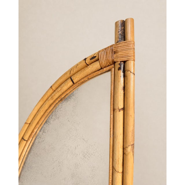 A striking pair of large 1970s Italian wall mirrors, each formed with an asymmetrical architectural arch combining a tall...