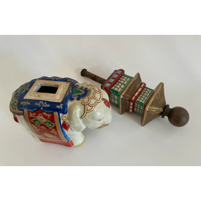 Vintage hand painted glazed ceramic Pagoda elephant. Bolt unscrews to remove the top from the base.