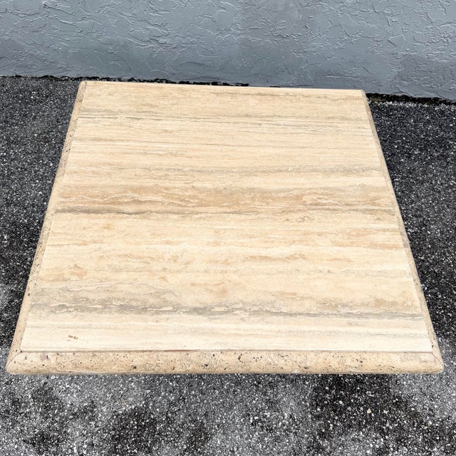 This Italian travertine coffee table showcases the natural beauty of stone with a softly sculpted bullnose edge. The...