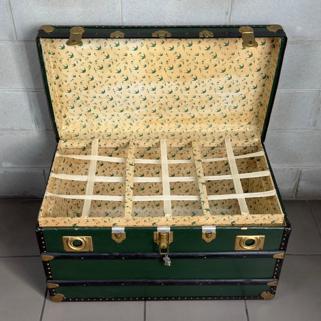 A distinctive and striking vintage travel trunk, solidly crafted from 20th-century wood and metal, finished in a...