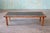 A large rectangular coffee table with a mix of gray coin tiles made by Jane and Gordon Martz in the 1960s for Marshall...