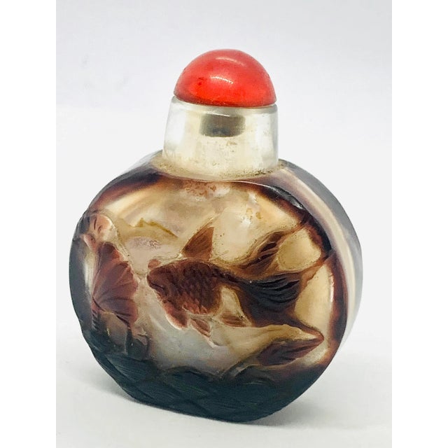 Early 20th Century Antique Chinese Carved Overlay Peking Glass Snuff Bottle. Featuring the traditional Chinese symbols of...