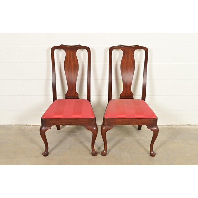 A gorgeous pair of Queen Anne or Georgian style side chairs or dining chairs By Henkel Harris USA, Circa Late 20th Century...