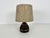 A beautiful large table lamp made in the 1960s. The base is made of brown ceramic. The lamp shade has a beige color. The...