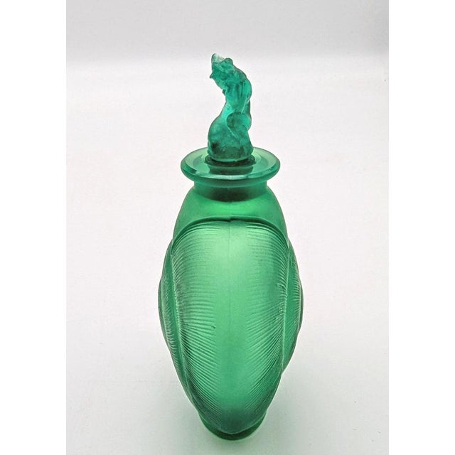 A highly rare and early Art Deco "Amphitrite" perfume bottle, designed by René Lalique circa 1920 and produced at his...