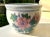Vintage Chinese fishbowl planter. Adorned with pink roses and green leaves. Blue and white Greek key pattern along the top...