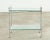 Stylish mid-century modern chrome and glass two tier bar cart made in the style and manner of Milo Baughman. The cart is...