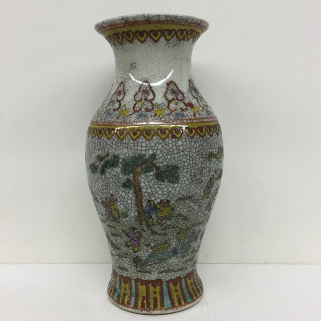 Nice colors on this cool and fairly worn vase. In good condition with uneven crackle from age.