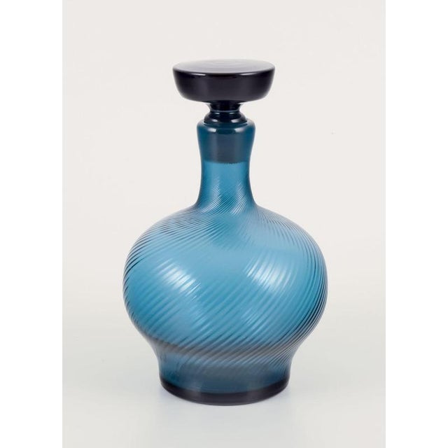 Signe persson-melin, swedish glass artist. Carafe with three cups. Handmade in blue art glass. Approximately 1970s....