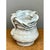 Exhibiting a unique sculptural form from the mid-20th century, this vintage handcrafted ceramic vase features a soft,...