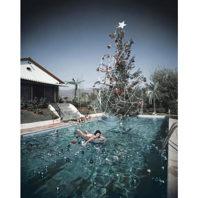 Christmas Swim 1956 by Slim Aarons Slim Aarons Limited Estate Edition Rita Aarons, wife of photographer Slim Aarons,...