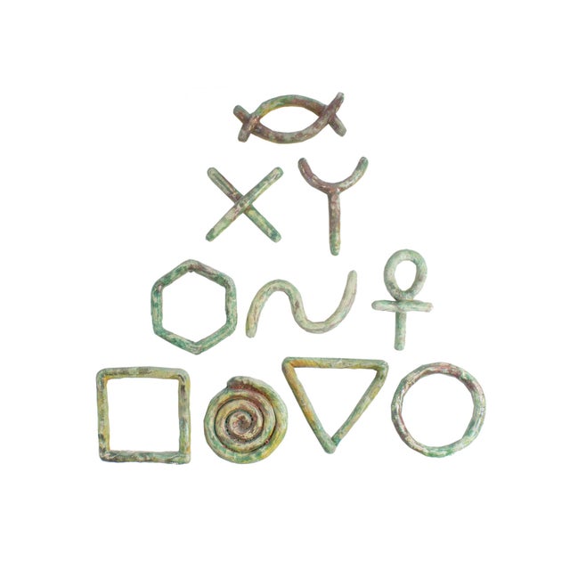 A 1991 set of ten ceramic wall sculptures by the American artist Ana England (born 1953). From England's "Essential...