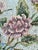 An American hooked rug, circa 1930s, depicting an airy arrangement of pink roses and flowering branches in a blue and...