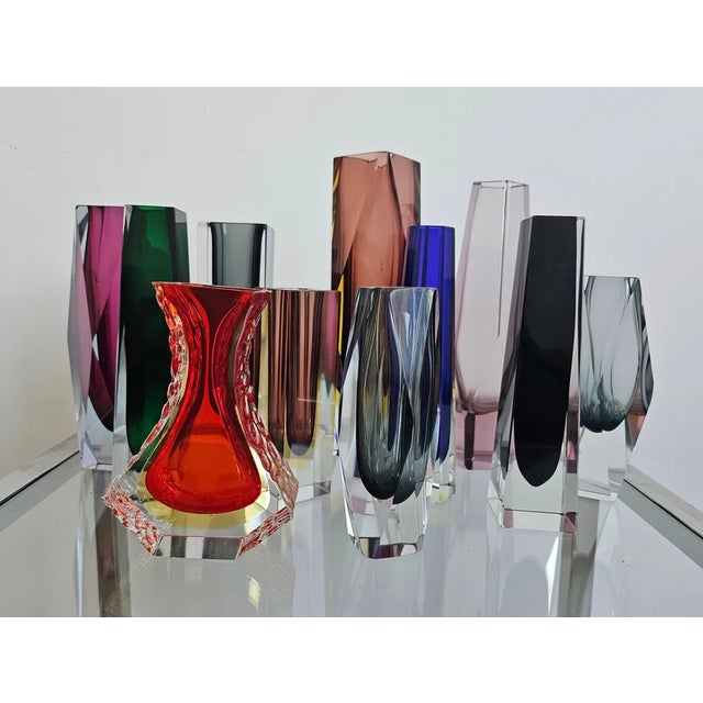 In this listing you will find a collection of 11 Mid Century Modern Sommerso glass vases, designed by Alessandro...