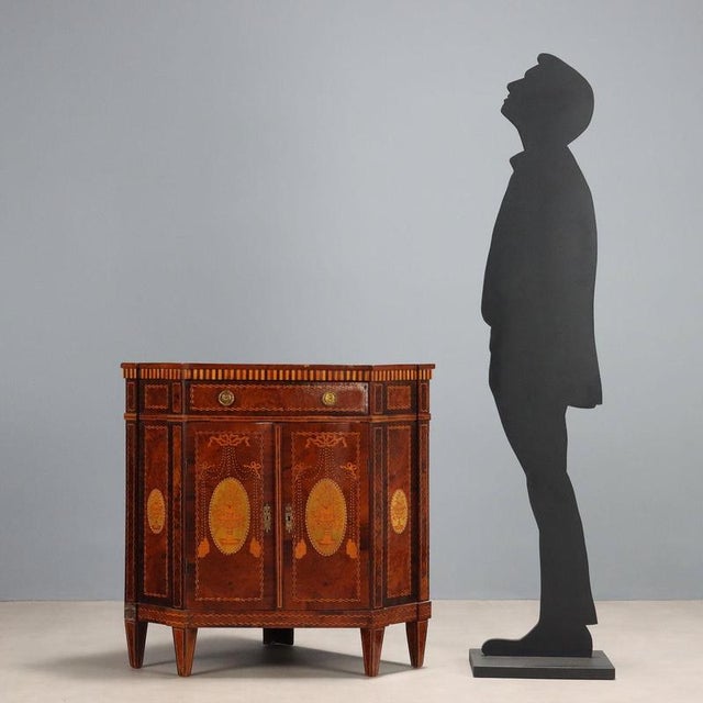 Neoclassical-style corner cabinet veneered in rosewood and various woods. Medallion inlays with vases and ribbons in maple...