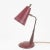 Articulated Mid-Century Modern desk lamp in dark red metal on Teak wood and brass arm is Modernist in design. Up to 250V...