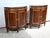Pair of solid and plated mahogany poisoning each opening by a double curved door with tab cutting underlined by a throat...