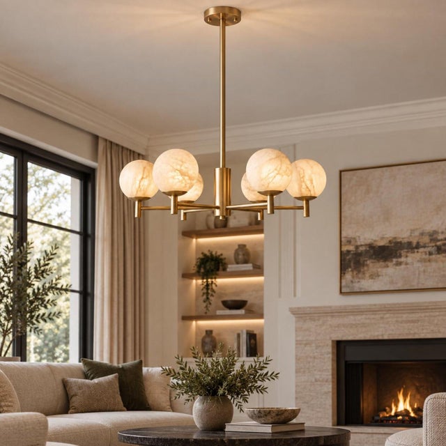 Bring sculptural warmth and natural stone character to the room with this handcrafted brass 6-light chandelier with...