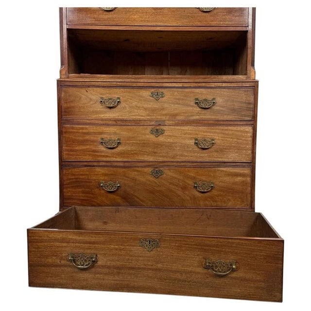 A fine 18th-century English Georgian chest on chest, beautifully crafted from mahogany and distinguished by its elegant...