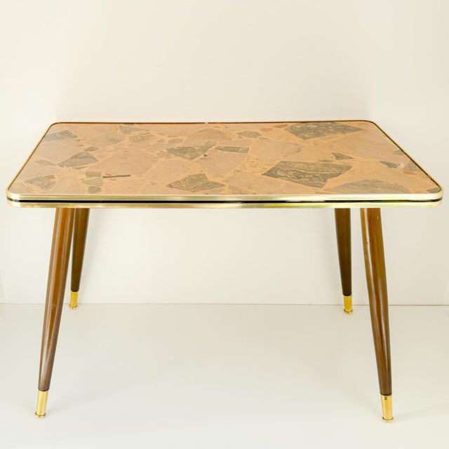 Wow\.\.what a lovely appearance is this unique vintage coffee table from the 50/60s. The rectangular table top is...