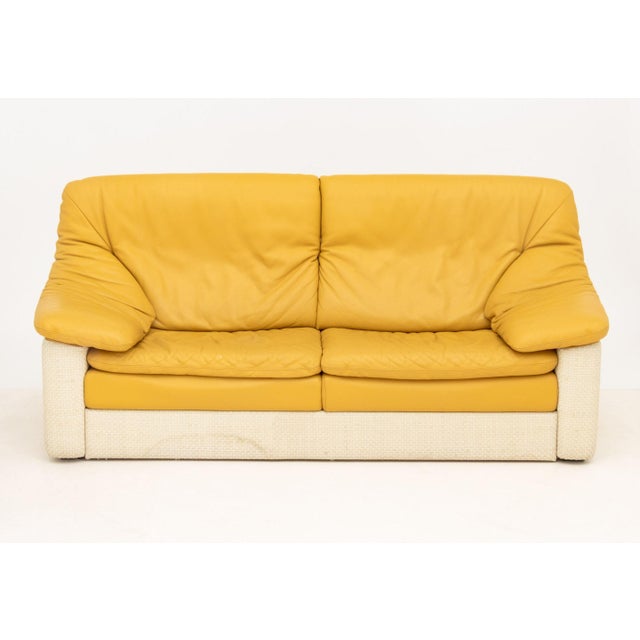 Gyform Two-Tone Leather Upholstered Sofa, tan leather cushions and adjustable back on white leather woven base, marked...