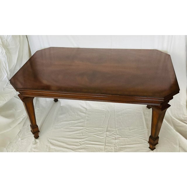Gorgeous coffee/ cocktail table by Maitland smith. Rick brown mahogany with. Beautiful grain. Exquisite detail in each...