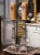 Commanding in scale and rich in devotional symbolism, this pair of antique church candlesticks brings dramatic...